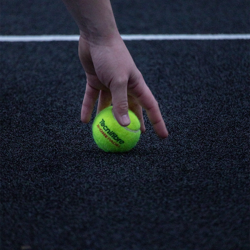 Hand picking up ball