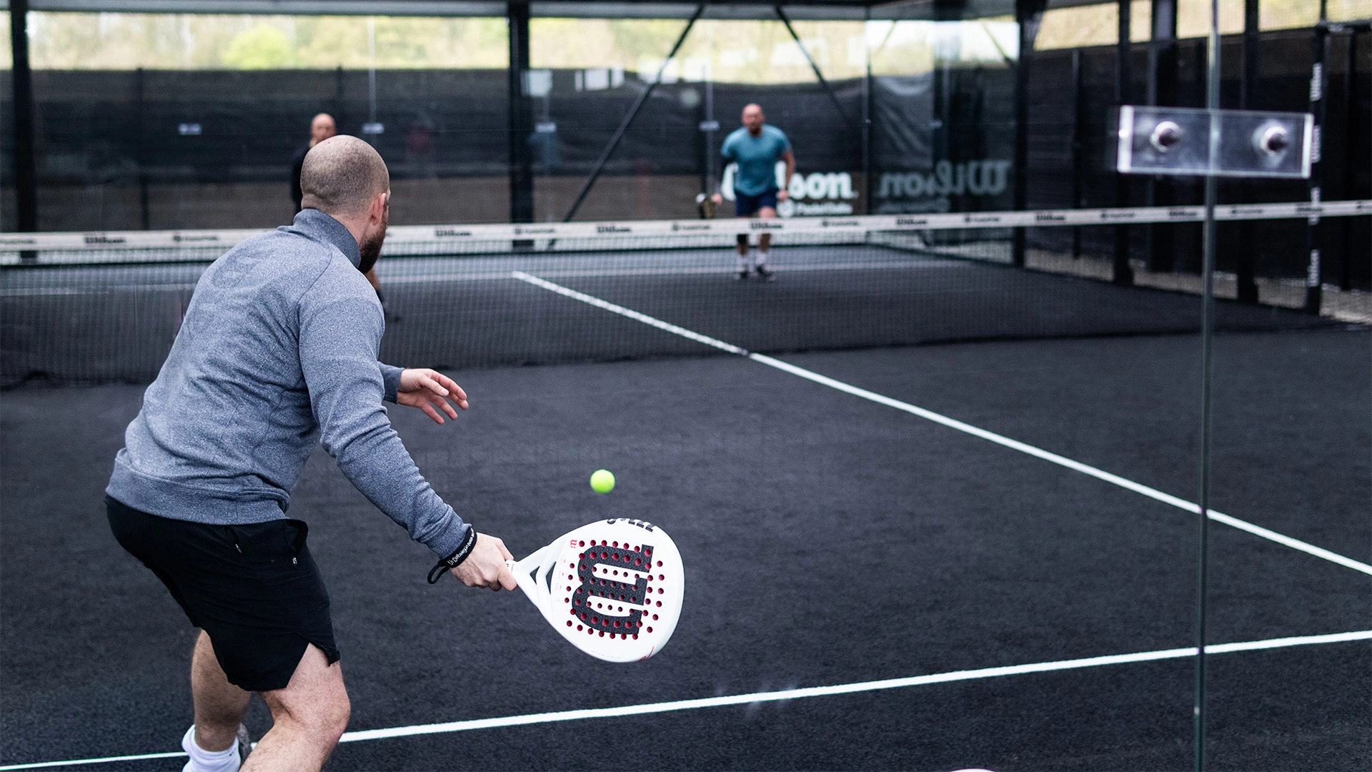 Player returning a serve