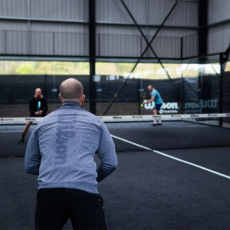 Player serving in the background